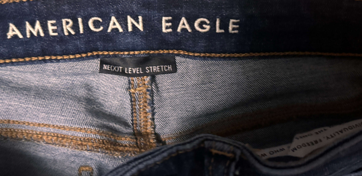 Close-up of American Eagle jeans with branding and text.