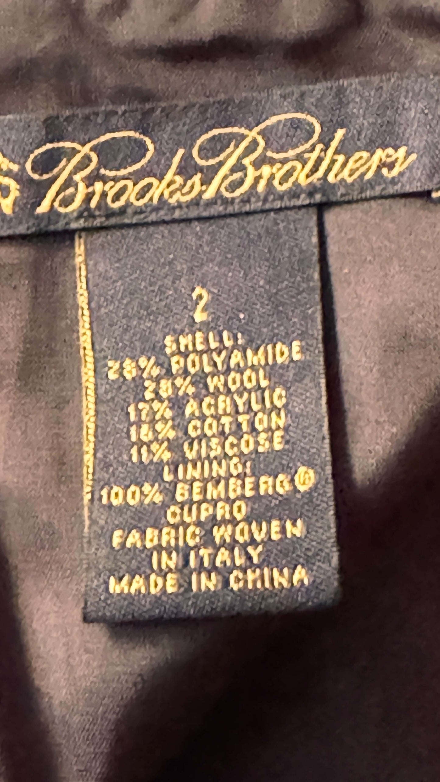 Brooks Brothers label on a garment with fabric composition details.