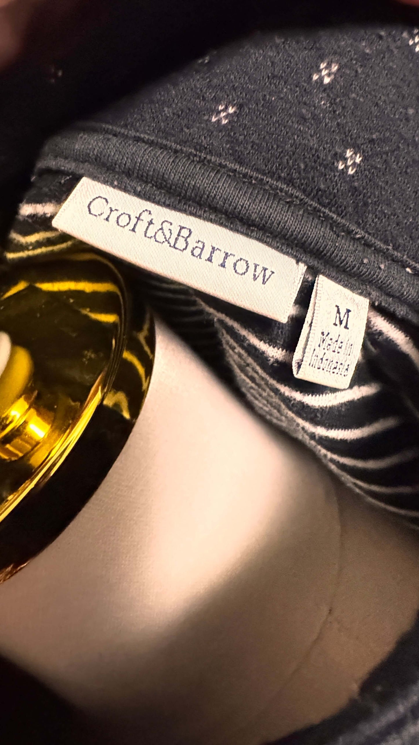 Clothing tag with 'Croft&Barrow' brand name on a garment.