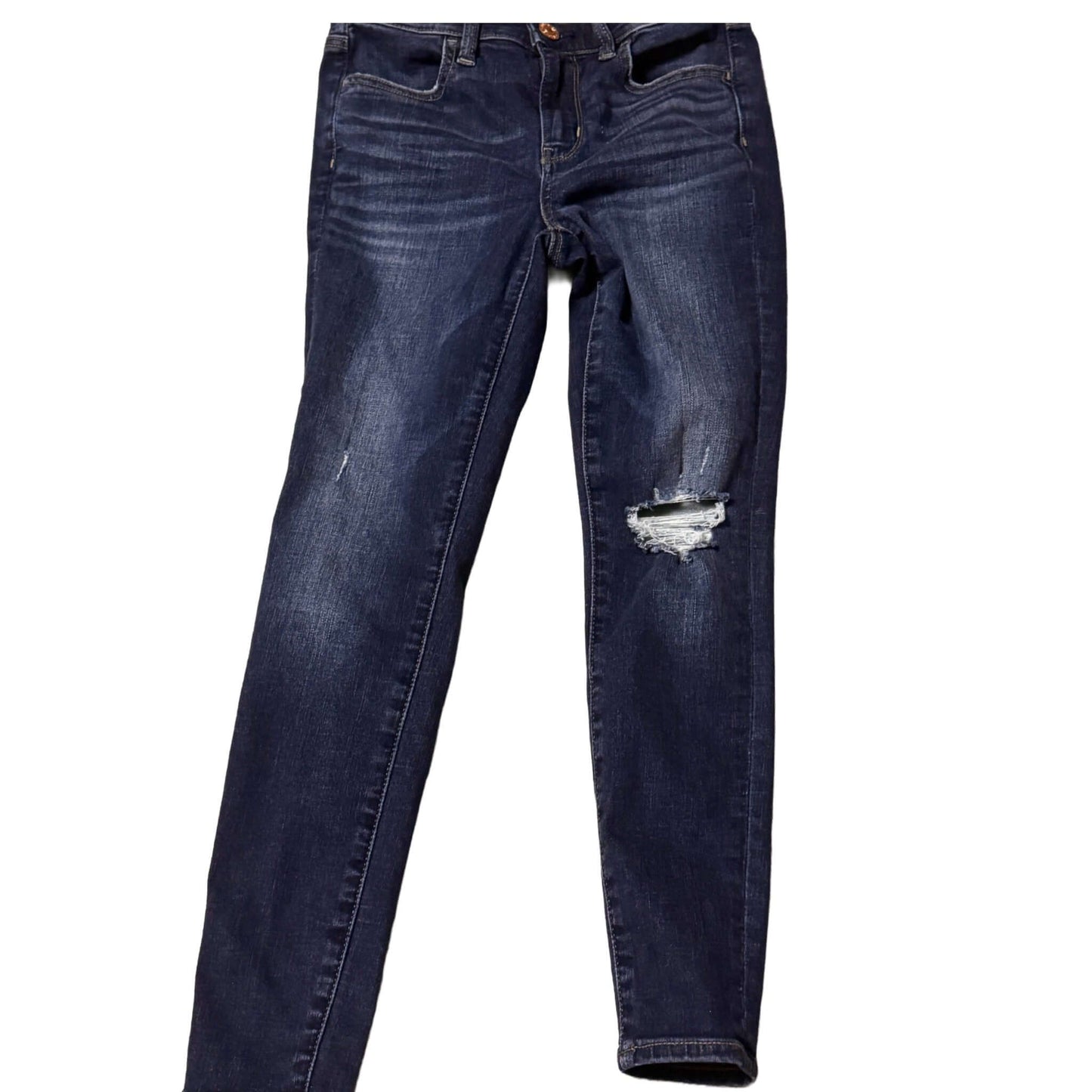 Blue jeans with a slight distressed look on a white background
