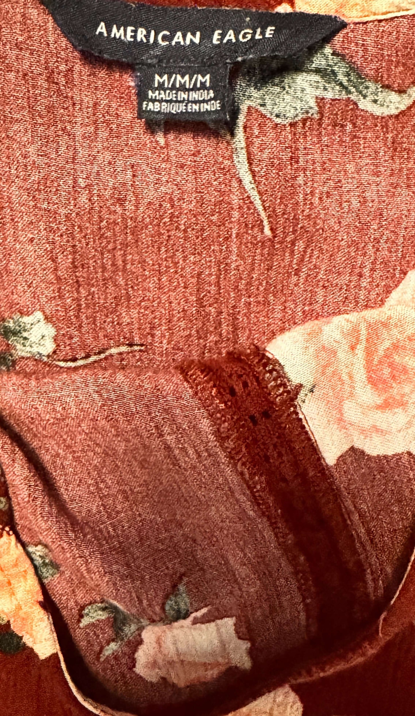 Floral patterned fabric with American Eagle label on a garment
