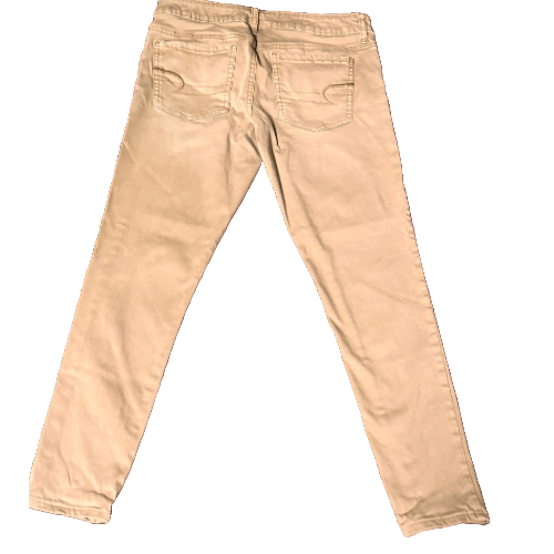 Back view of American Eagle tan denim pants in size 4 petite, showcasing the slim fit and design.