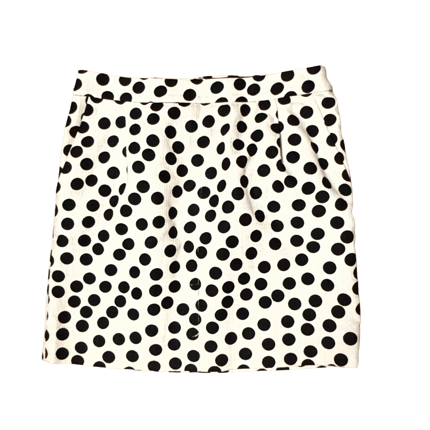Black and white polka dot skirt on a white background