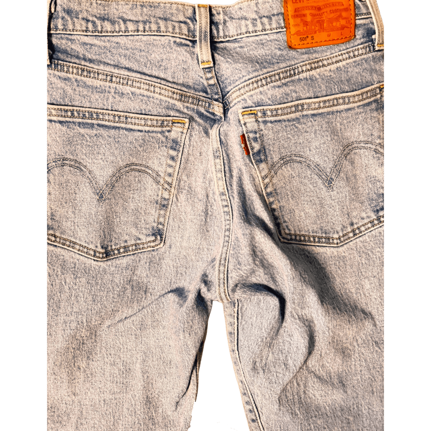 Close-up of Levi's jeans with a focus on the back pocket and brand tag.