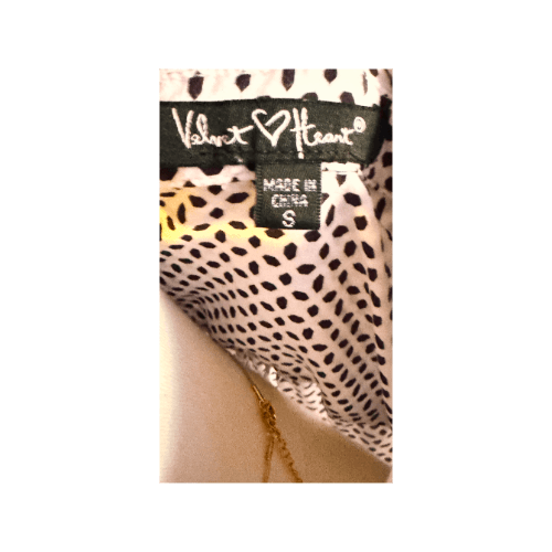 Label of Velvet Heart blouse showing size small with black geometric pattern on fabric.