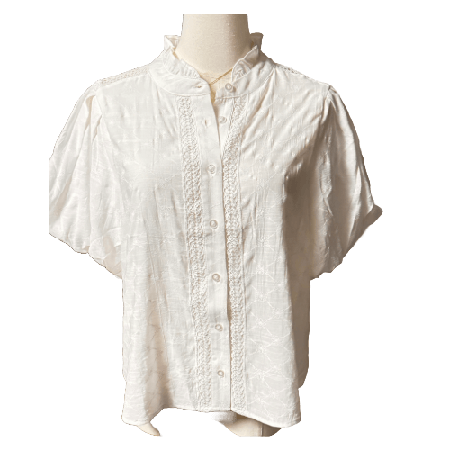 Elegant white blouse top with puffy sleeves and button-up design, perfect for casual or dressy occasions.