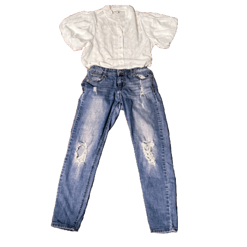 Stylish secondhand white blouse with puffy sleeves paired with distressed denim jeans
