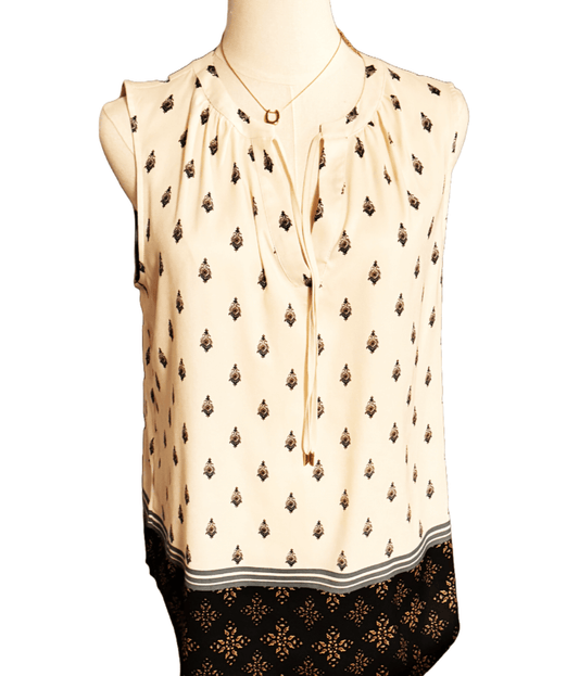 Ann Taylor sleeveless blouse in size medium petite, featuring a pattern and elegant design, perfect for casual or professional wear.
