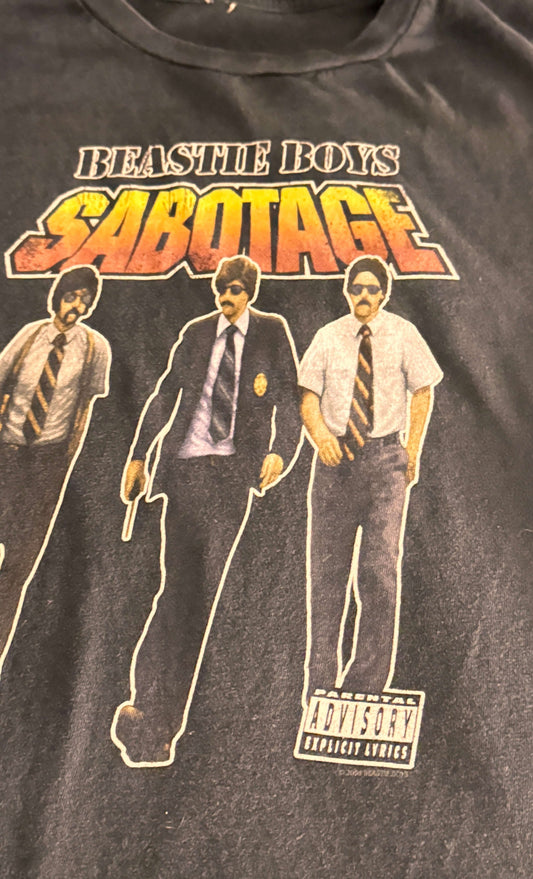 Vintage Beastie Boys Sabotage T-shirt featuring iconic band members in classic attire, size Small unisex tee.