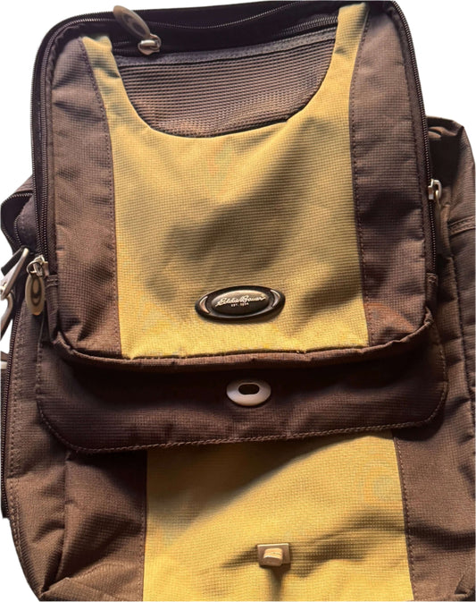 Eddie Bauer vintage backpack in excellent condition, featuring unique brown and yellow design, essential for hiking.