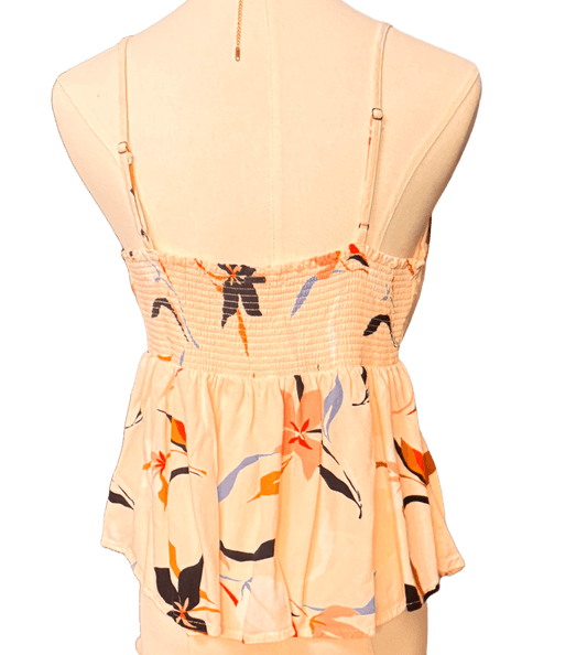 Beige floral dress on a mannequin with a white background
