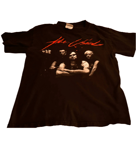 Black t-shirt with a graphic of a band and red text on a white background