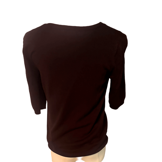 Black blouse on a mannequin with a white background