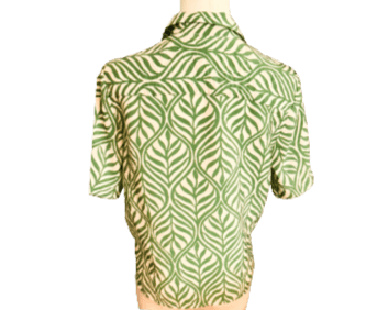 Green patterned shirt on a mannequin against a white background