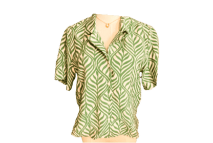 Green patterned blouse on a white background