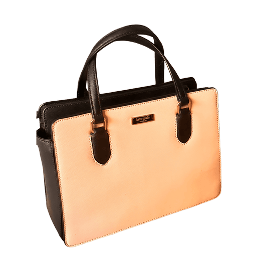 Handbag with black handles and trim on a white background