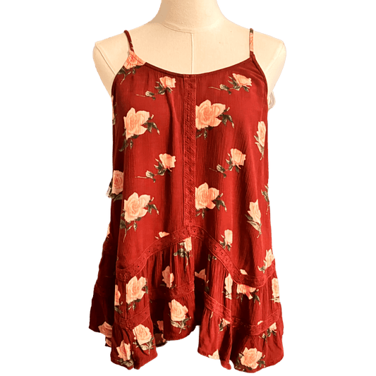 Red floral dress on a mannequin against a white background