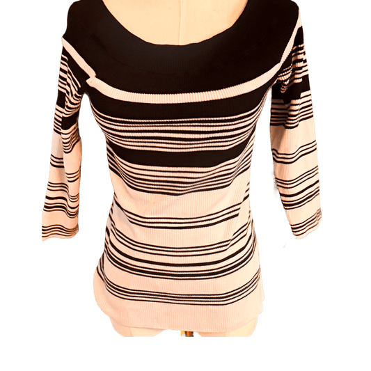 Black and white striped dress on a mannequin against a white background