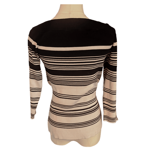 Black and white  striped sweater on a mannequin against a white background